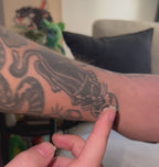 Hold Fast tattoo aftercare balm 100ml by Penguin Tattoo Co, Australian made, fragrance free being applied to tattoos on arm
